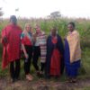 Reisende während Kulturerfahrung Maasai